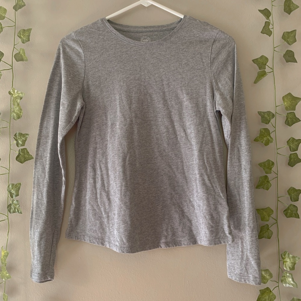 This is a grey, long sleeve shirt.